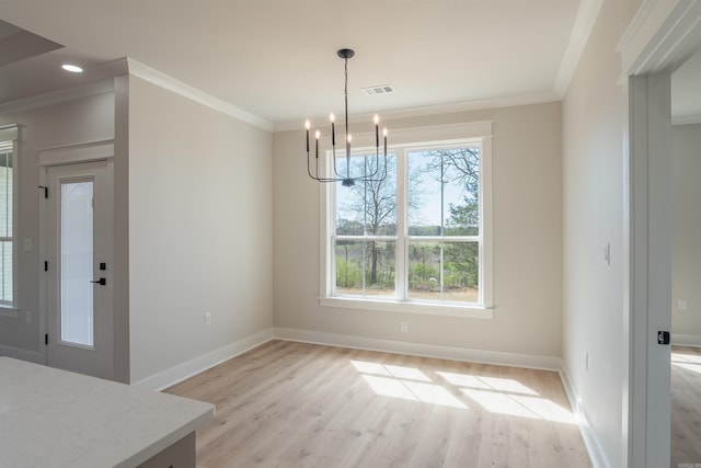 240 Michelle Dr, Beebe, AR 72012 - unfurnished dining area with a notable chandelier, visible vents, baseboards, and light wood-style flooring