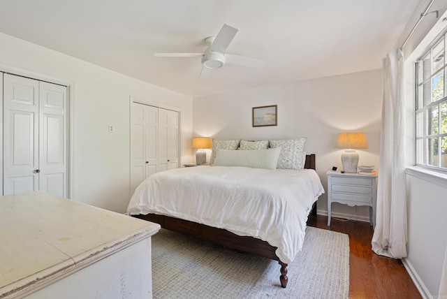 5 Huntington Rd, Little Rock, AR 72227 - bedroom with ceiling fan, baseboards, wood finished floors, and two closets