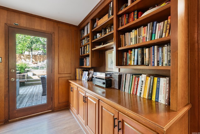 5 Huntington Rd, Little Rock, AR 72227 - interior space with light wood-style flooring, built in desk, bookshelves, wooden walls, and ornamental molding