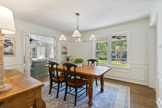 5 Huntington Rd, Little Rock, AR 72227 - dining space with crown molding, wainscoting, wood finished floors, ceiling fan, and a decorative wall