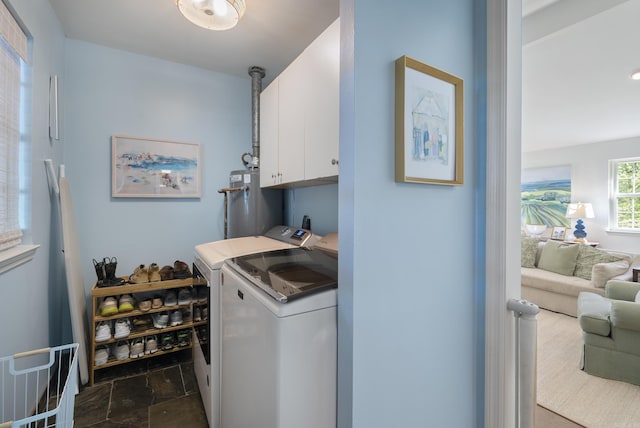 5 Huntington Rd, Little Rock, AR 72227 - clothes washing area with cabinet space, independent washer and dryer, stone finish flooring, and water heater