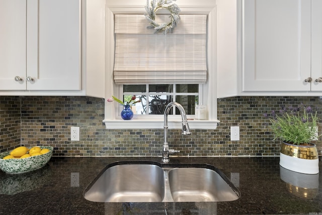5 Huntington Rd, Little Rock, AR 72227 - kitchen featuring white cabinets, a sink, dark stone counters, and tasteful backsplash