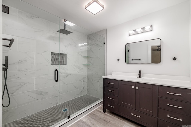 736 Beech Cir, Arkadelphia, AR 71923 - bathroom with a marble finish shower, vanity, and wood finished floors