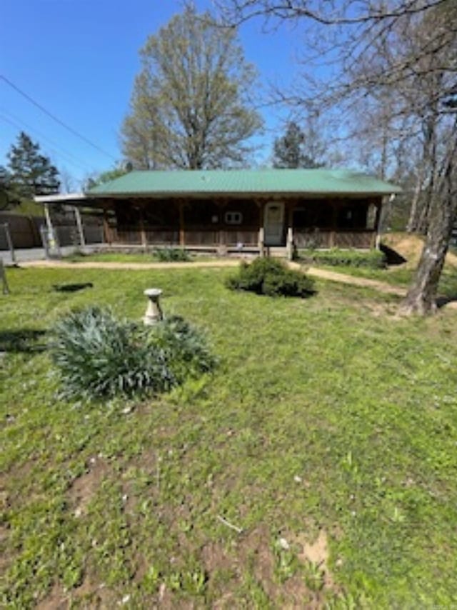 view of front of house with an exterior structure and an outbuilding