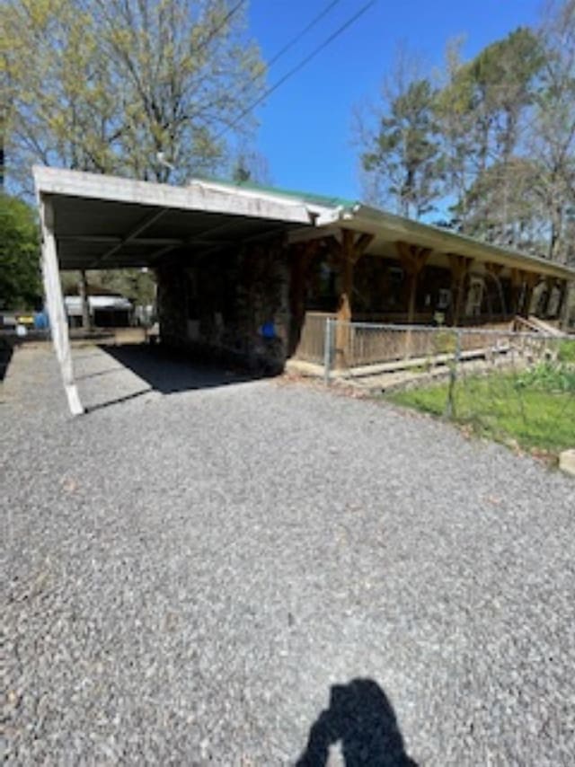 view of car parking with aphalt driveway