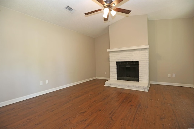 unfurnished living room with dark wood-style flooring, baseboards, a ceiling fan, visible vents, and lofted ceiling