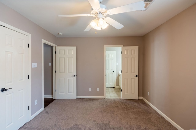 408 Crain Dr, Searcy, AR 72143 - unfurnished bedroom with baseboards, a ceiling fan, and carpet floors