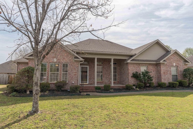 408 Crain Dr, Searcy, AR 72143 - single story home featuring a shingled roof, covered porch, a front lawn, and brick siding
