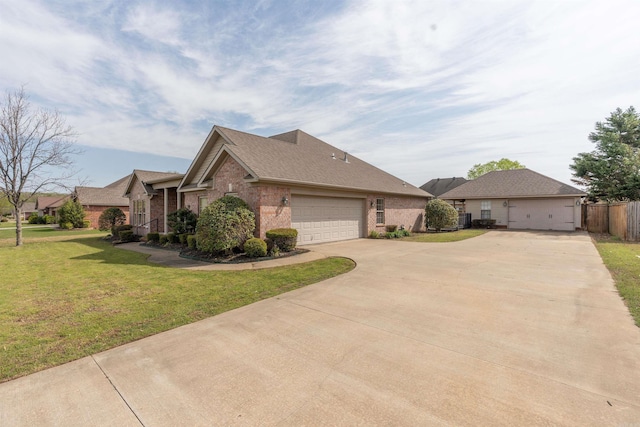 408 Crain Dr, Searcy, AR 72143 - ranch-style home with a front yard, fence, brick siding, an attached garage, and driveway