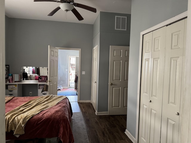bedroom with ceiling fan, visible vents, baseboards, and dark wood finished floors