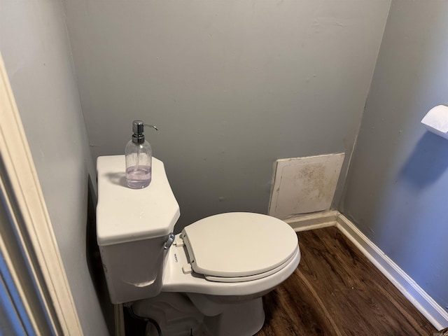 bathroom featuring toilet and wood finished floors