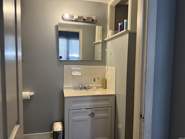bathroom with vanity and backsplash