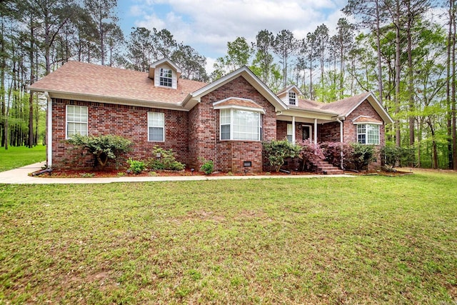 7 Ridge Creek Pt, Arkadelphia, AR 71923 - view of front of home with roof with shingles, brick siding, and a front lawn
