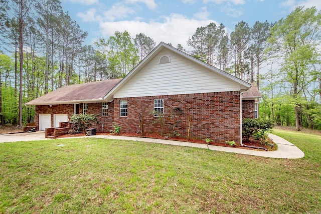 7 Ridge Creek Pt, Arkadelphia, AR 71923 - back of house with brick siding, a garage, driveway, and a lawn
