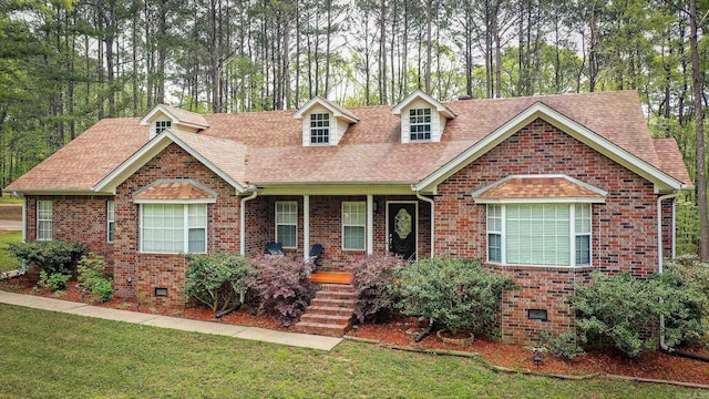 7 Ridge Creek Pt, Arkadelphia, AR 71923 - view of front of home with crawl space, covered porch, roof with shingles, a front yard, and brick siding