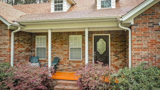 7 Ridge Creek Pt, Arkadelphia, AR 71923 - property entrance featuring a porch, a shingled roof, and brick siding
