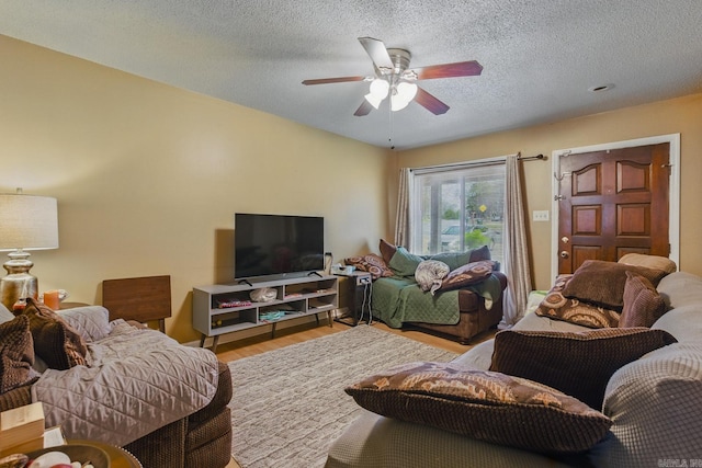 318 Burnside Dr, Little Rock, AR 72205 - living room featuring a textured ceiling, a ceiling fan, and wood finished floors