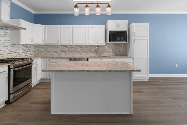 8010 Kanis Oaks Dr, Little Rock, AR 72204 - kitchen with crown molding, stainless steel range with gas cooktop, wall chimney exhaust hood, black microwave, and a sink