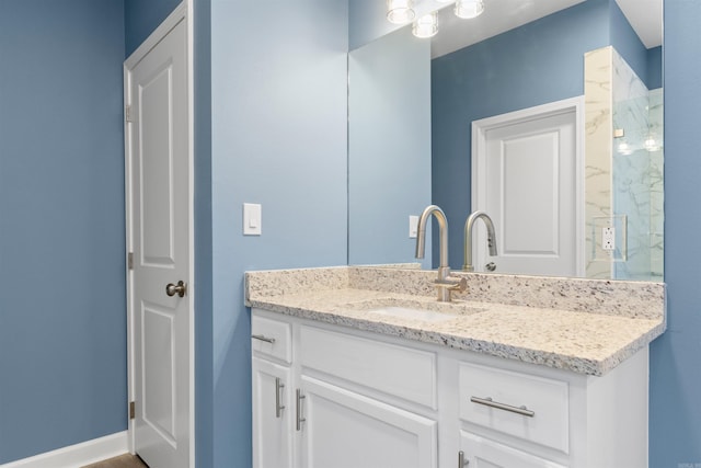 8010 Kanis Oaks Dr, Little Rock, AR 72204 - bathroom featuring a marble finish shower, baseboards, and vanity