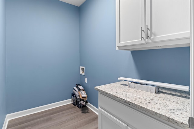 8010 Kanis Oaks Dr, Little Rock, AR 72204 - laundry room with light wood-style floors, baseboards, hookup for a washing machine, and cabinet space