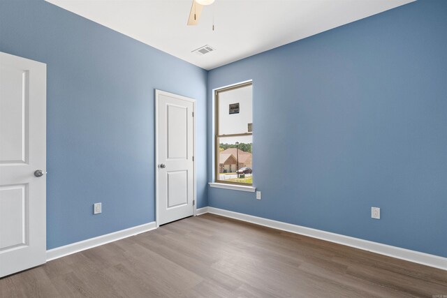 8010 Kanis Oaks Dr, Little Rock, AR 72204 - spare room with wood finished floors, baseboards, a ceiling fan, and visible vents