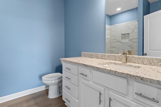 8010 Kanis Oaks Dr, Little Rock, AR 72204 - full bath with baseboards, toilet, vanity, wood finished floors, and a marble finish shower