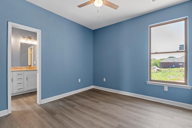 8010 Kanis Oaks Dr, Little Rock, AR 72204 - unfurnished room featuring wood finished floors, baseboards, and a ceiling fan