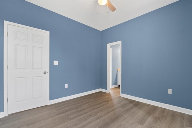 8010 Kanis Oaks Dr, Little Rock, AR 72204 - unfurnished room featuring wood finished floors, ceiling fan, and baseboards