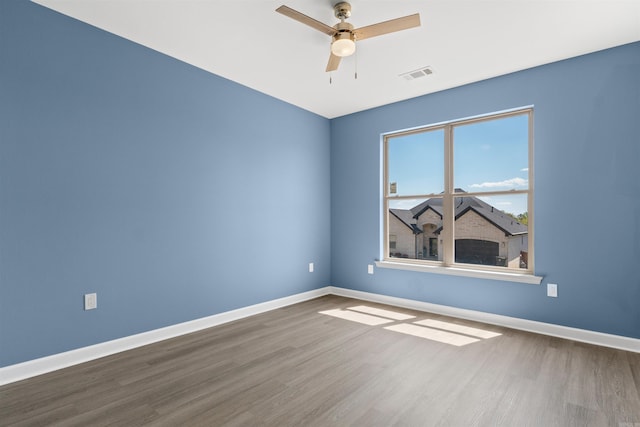 8010 Kanis Oaks Dr, Little Rock, AR 72204 - unfurnished room with wood finished floors, baseboards, and visible vents