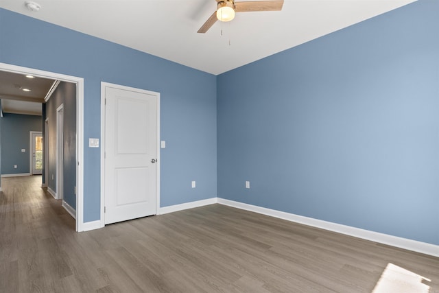 8010 Kanis Oaks Dr, Little Rock, AR 72204 - empty room with baseboards, wood finished floors, and ceiling fan