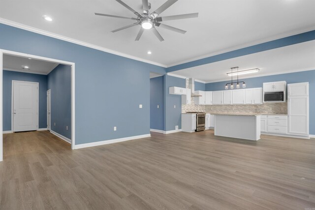 8010 Kanis Oaks Dr, Little Rock, AR 72204 - unfurnished living room with light wood finished floors, ornamental molding, and a ceiling fan