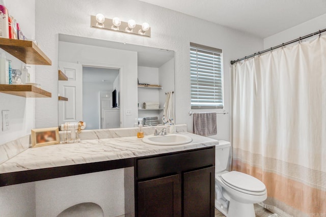 full bathroom with toilet, vanity, and a shower with curtain