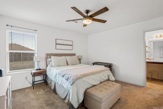 bedroom featuring baseboards, light carpet, a ceiling fan, connected bathroom, and visible vents