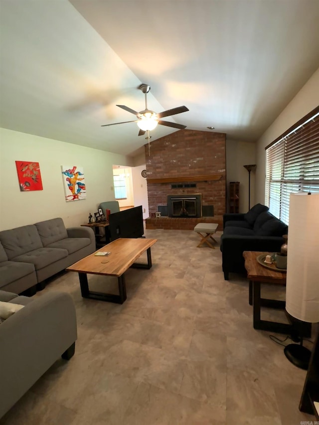 living room featuring ceiling fan, lofted ceiling, and a fireplace