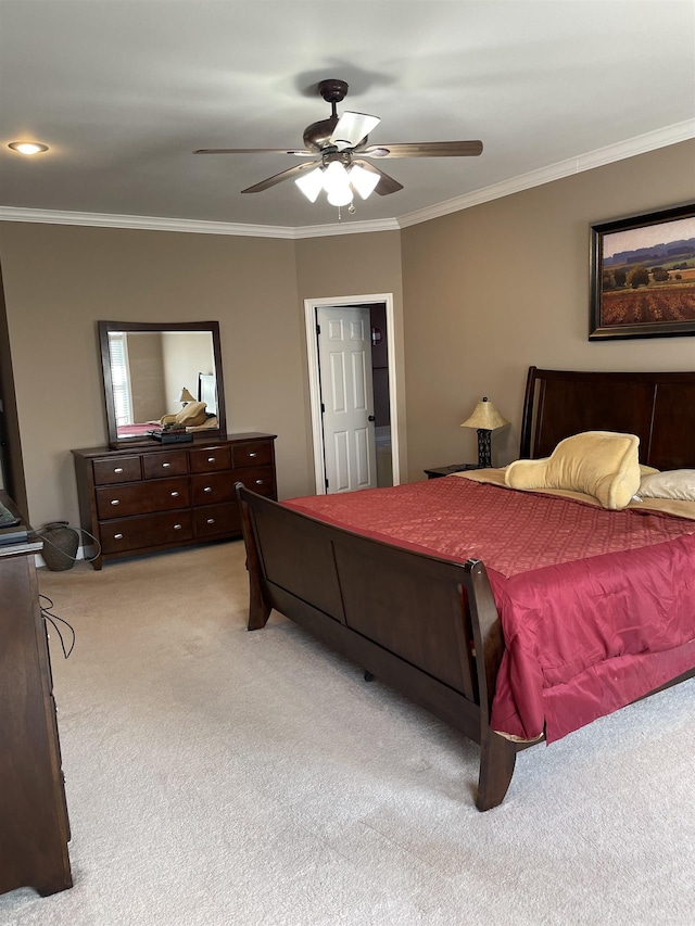 bedroom with ornamental molding, ceiling fan, and light colored carpet