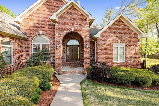 exterior space featuring brick siding
