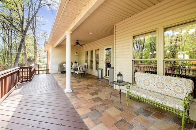 wooden terrace with a ceiling fan