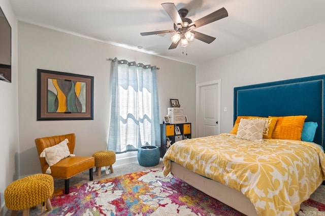 bedroom with a ceiling fan and carpet floors