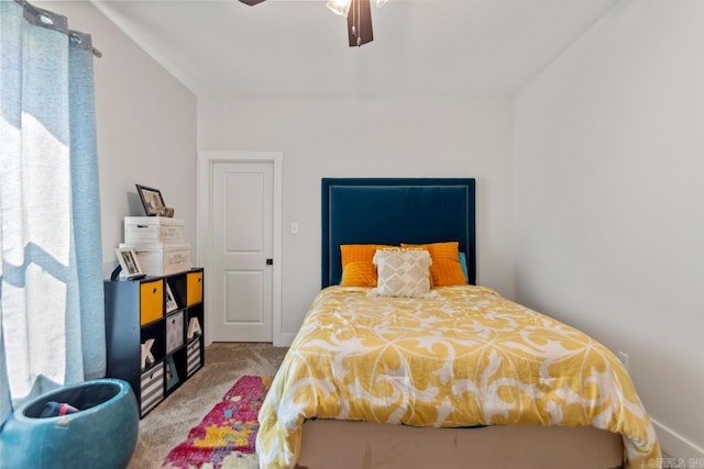 carpeted bedroom with a ceiling fan