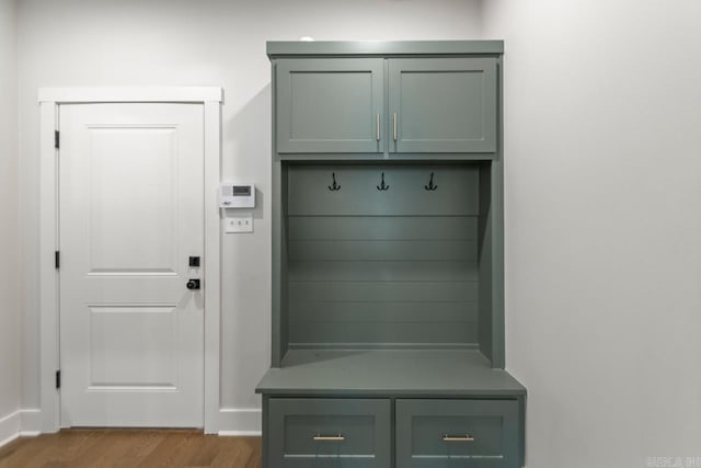 mudroom featuring baseboards and wood finished floors