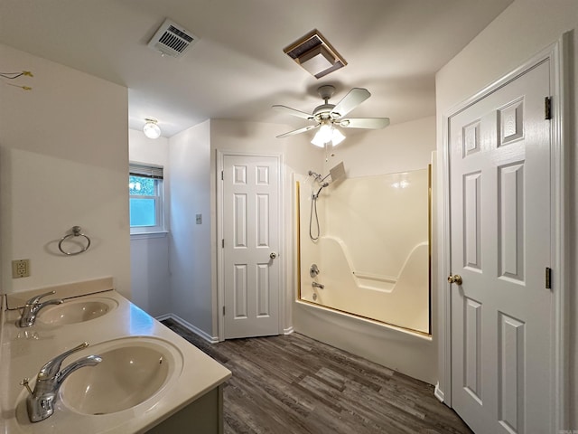 3 Park Ridge Dr, Maumelle, AR 72113 - bathroom featuring bathtub / shower combination, ceiling fan, wood finished floors, and double vanity