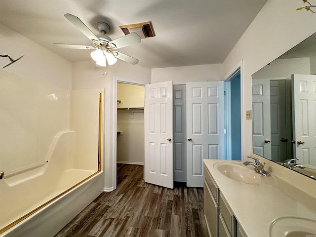 3 Park Ridge Dr, Maumelle, AR 72113 - full bathroom with wood finished floors, ceiling fan, bathing tub / shower combination, double vanity, and baseboards