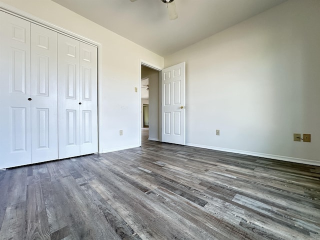 3 Park Ridge Dr, Maumelle, AR 72113 - unfurnished bedroom with dark wood-style flooring, baseboards, a closet, and a ceiling fan