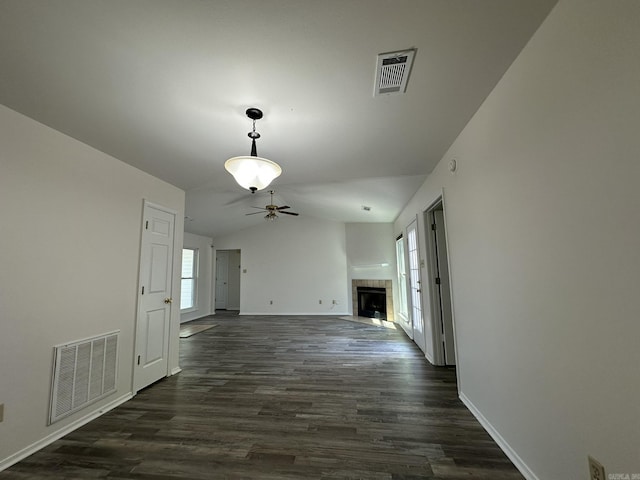 3 Park Ridge Dr, Maumelle, AR 72113 - unfurnished room with a ceiling fan, vaulted ceiling, a fireplace, dark wood-type flooring, and baseboards