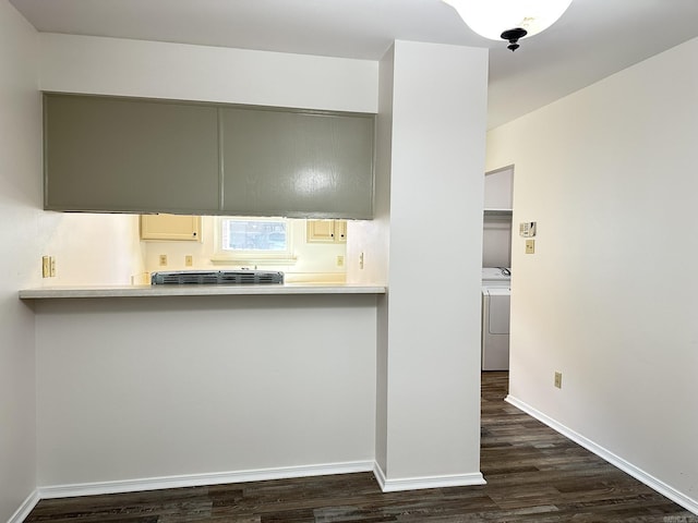 3 Park Ridge Dr, Maumelle, AR 72113 - kitchen with dark wood-style flooring, baseboards, light countertops, and washing machine and clothes dryer