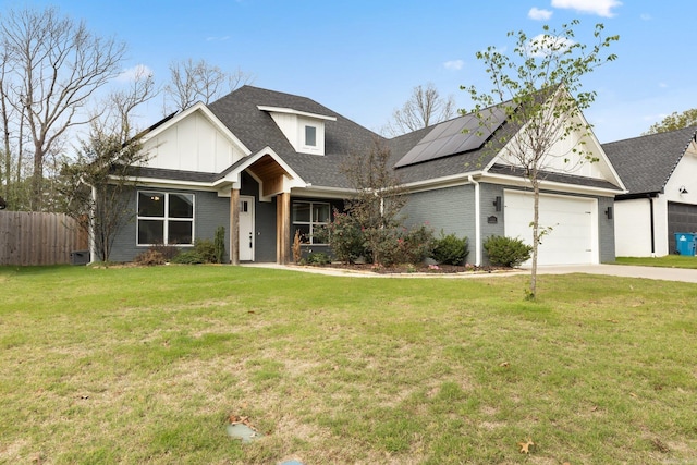 craftsman house with roof mounted solar panels, a garage, fence, a front lawn, and driveway