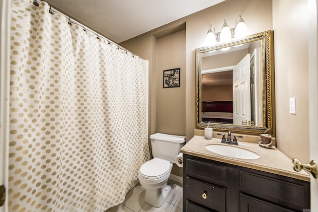 full bathroom with tile patterned flooring, vanity, and toilet