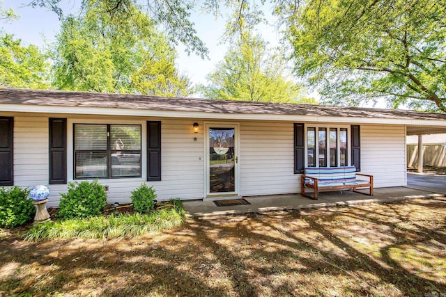 view of front of home featuring a carport