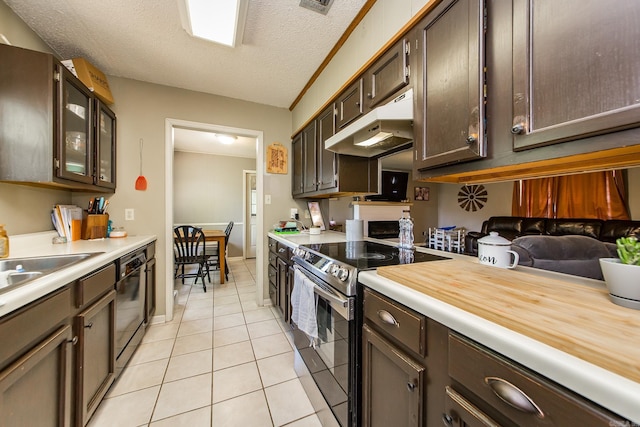 kitchen with light tile patterned floors, electric range, black dishwasher, under cabinet range hood, and light countertops