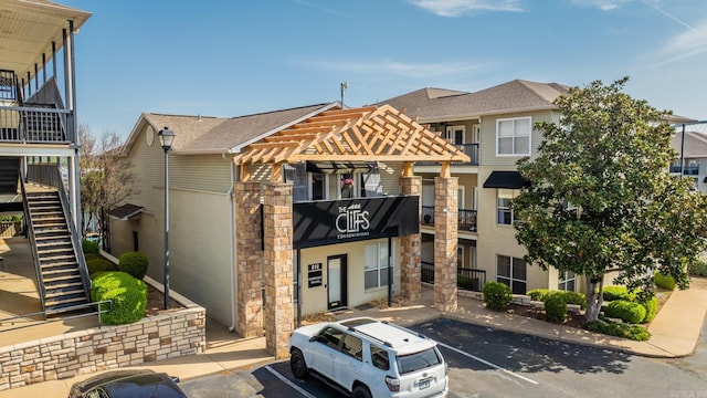 820 N St, Little Rock, AR 72201 - view of property with uncovered parking and stairs